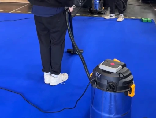 vfx screen clean and repair services blue vfx screen being cleaned. Man with white trainers standing on textile with steam cleaner