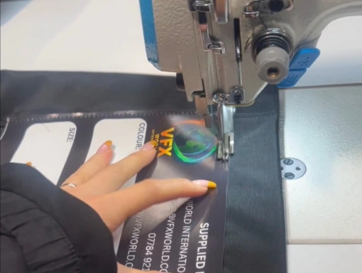 vfx screens machinist sewing on label
